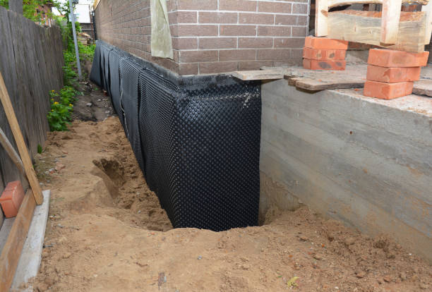 SJ Waterproofing Pros technician performing targeted Waterproofing assessment in Marion, MI